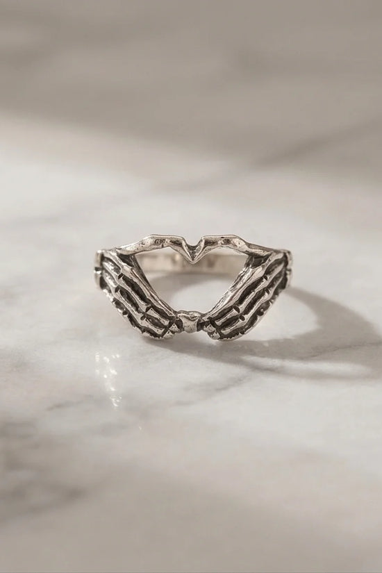 Eternal Embrace: Skeleton Heart Hands Ring