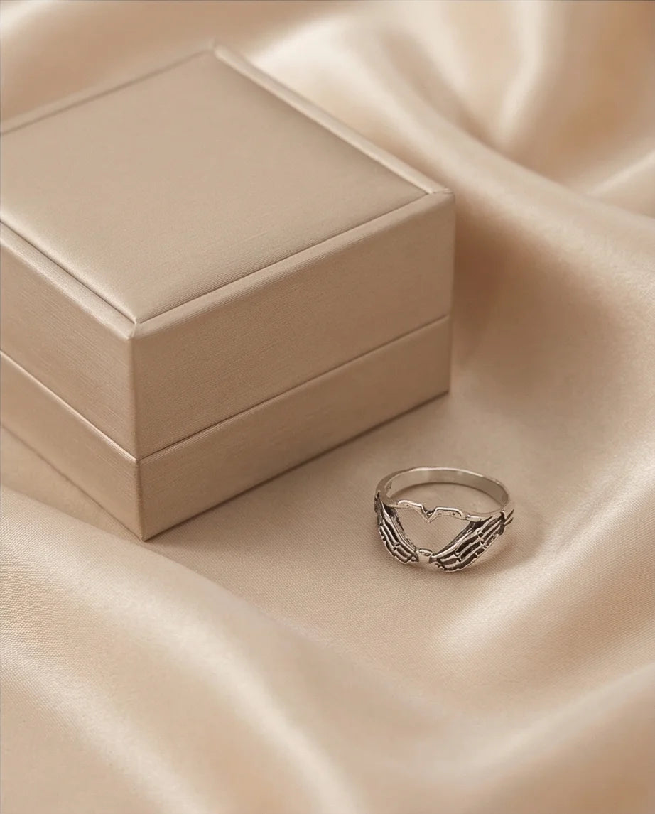 Eternal Embrace: Skeleton Heart Hands Ring