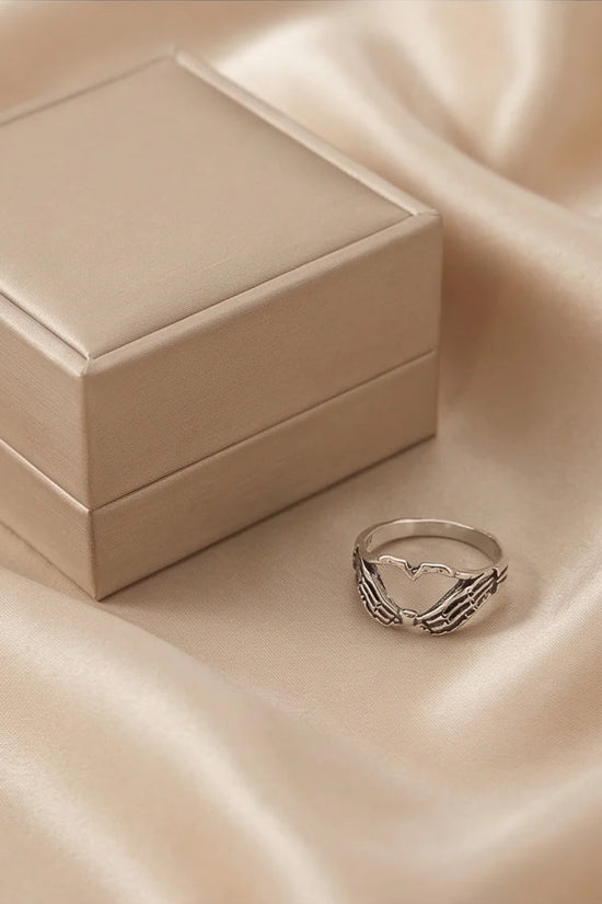 Eternal Embrace: Skeleton Heart Hands Ring