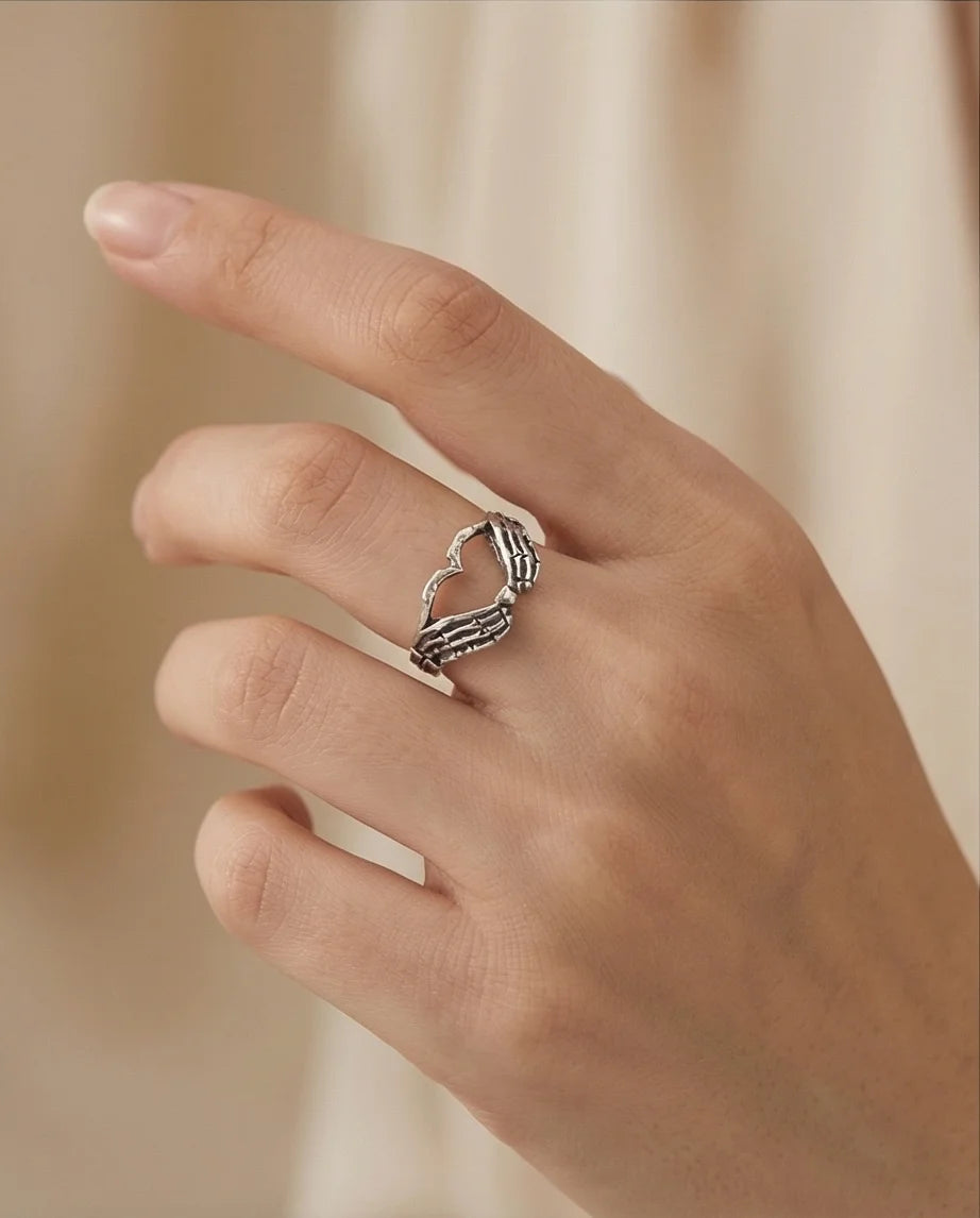 Eternal Embrace: Skeleton Heart Hands Ring