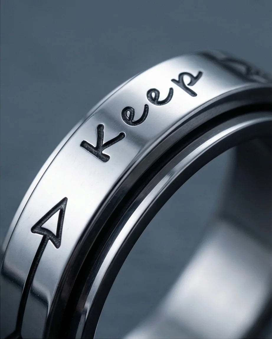 The Momentum Band: "Keep Going" Arrow Spinner