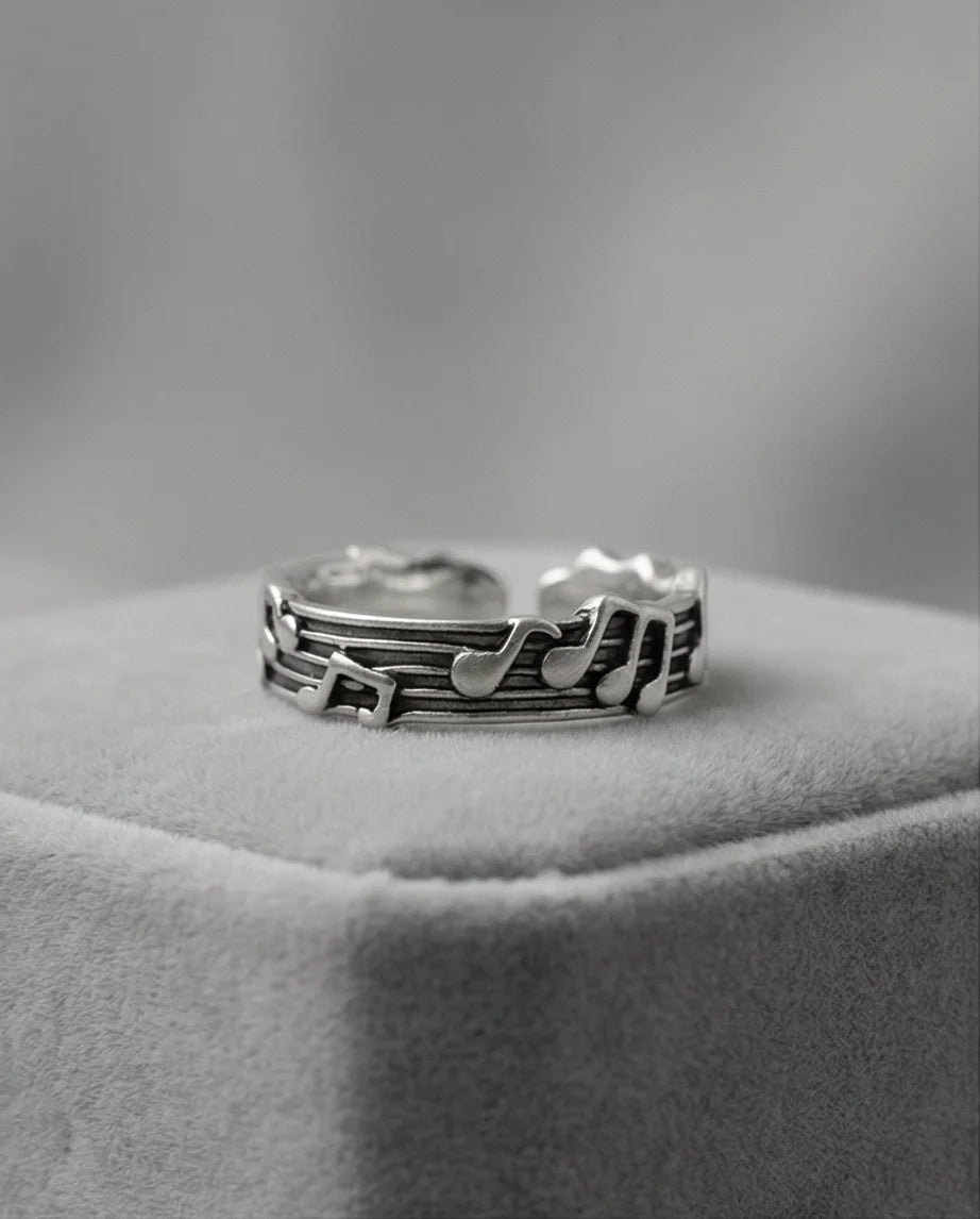 The Melodic Echo: Antique Silver Musical Note Band