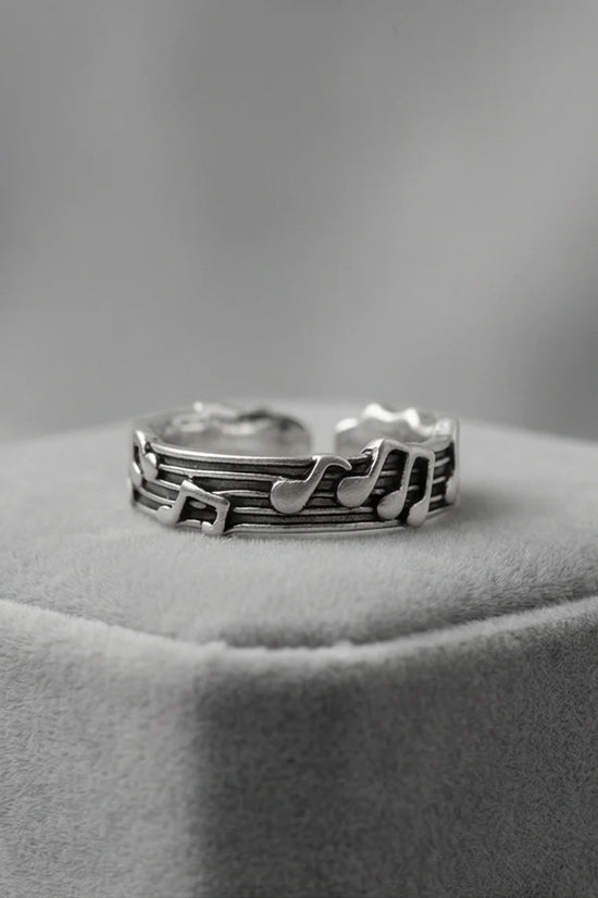 The Melodic Echo: Antique Silver Musical Note Band