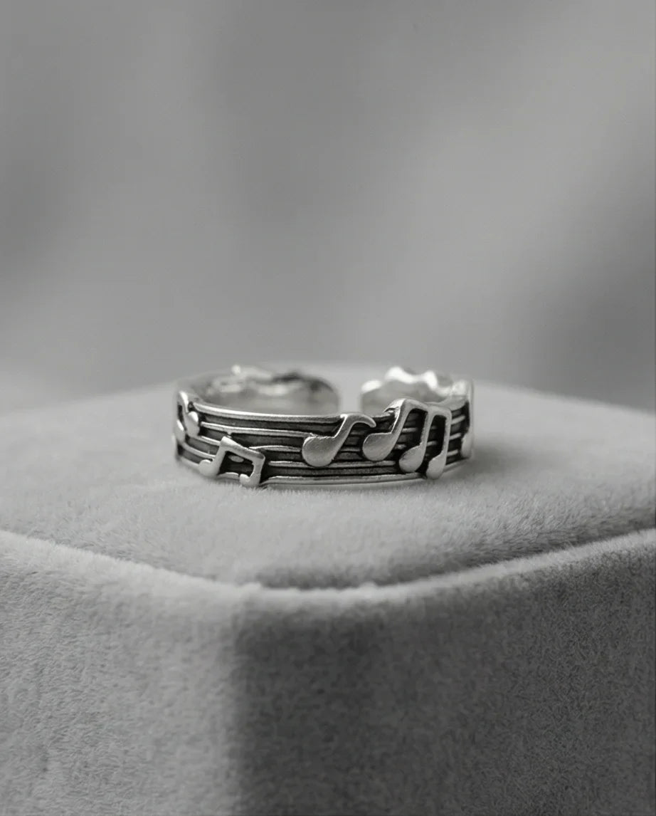 The Melodic Echo: Antique Silver Musical Note Band