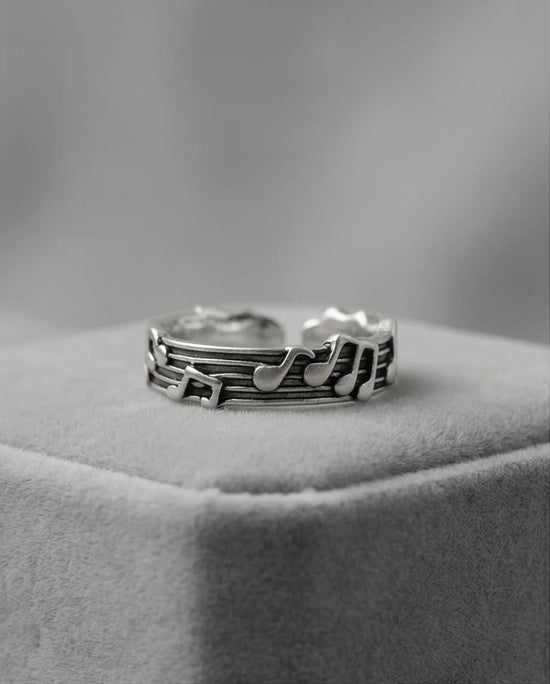 The Melodic Echo: Antique Silver Musical Note Band