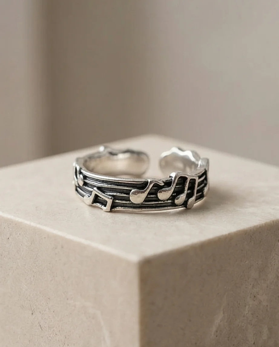 The Melodic Echo: Antique Silver Musical Note Band