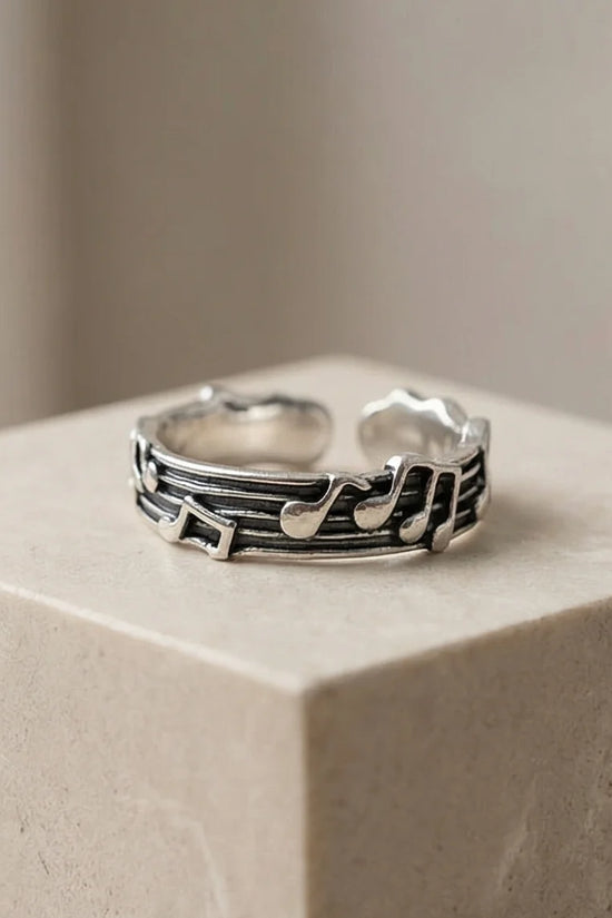 The Melodic Echo: Antique Silver Musical Note Band