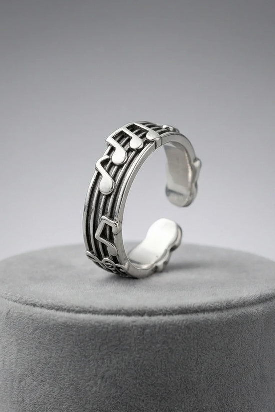 The Melodic Echo: Antique Silver Musical Note Band