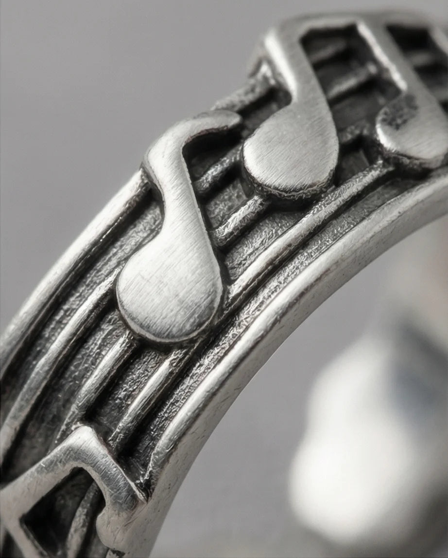 The Melodic Echo: Antique Silver Musical Note Band