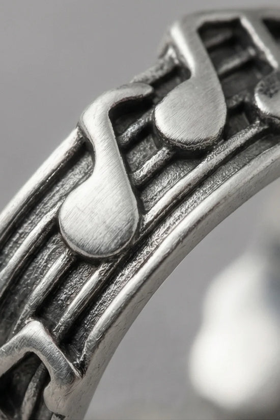 The Melodic Echo: Antique Silver Musical Note Band