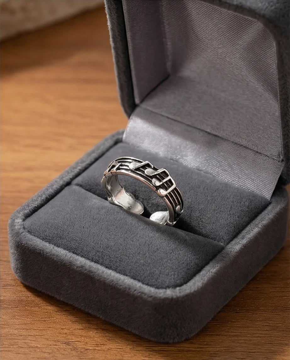 The Melodic Echo: Antique Silver Musical Note Band