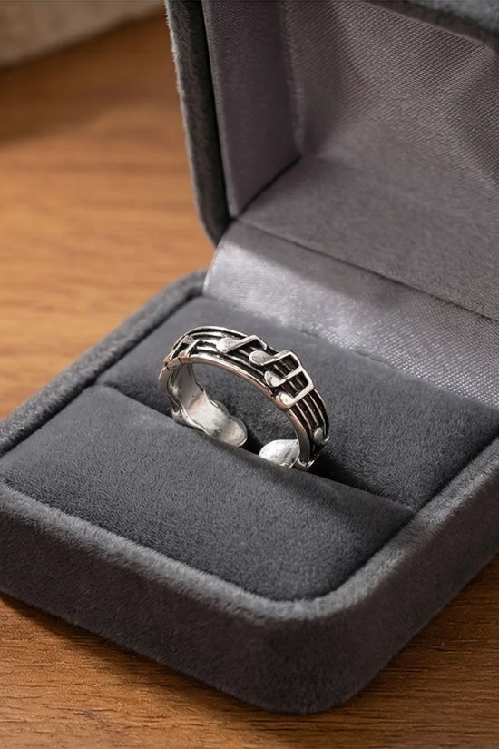 The Melodic Echo: Antique Silver Musical Note Band