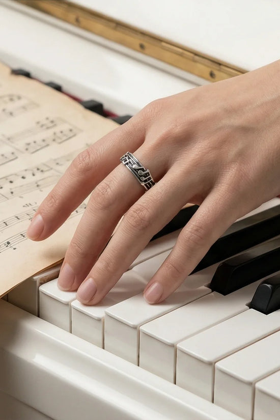 The Melodic Echo: Antique Silver Musical Note Band