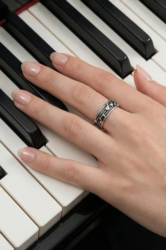 The Melodic Echo: Antique Silver Musical Note Band