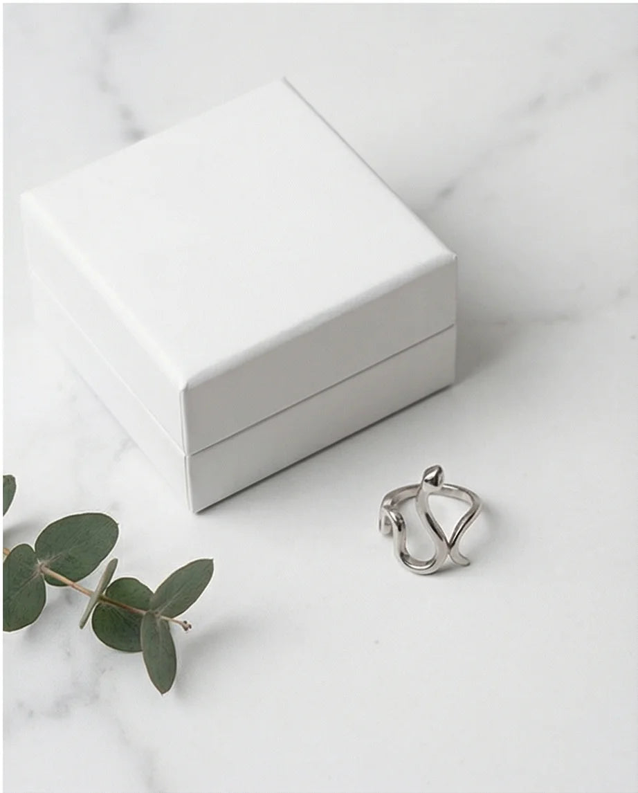 Silver Coil: Sleek Sculptural Serpentine Ring
