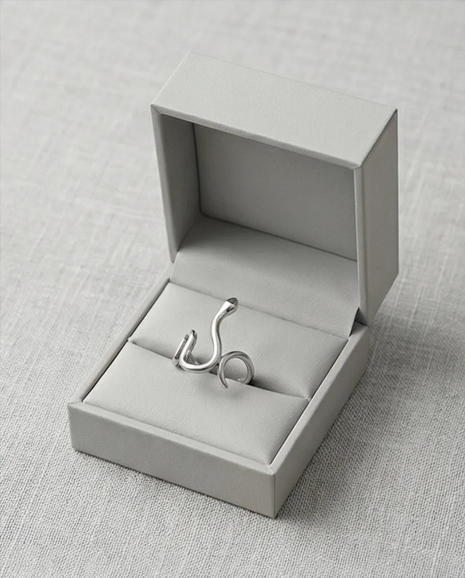 Silver Coil: Sleek Sculptural Serpentine Ring