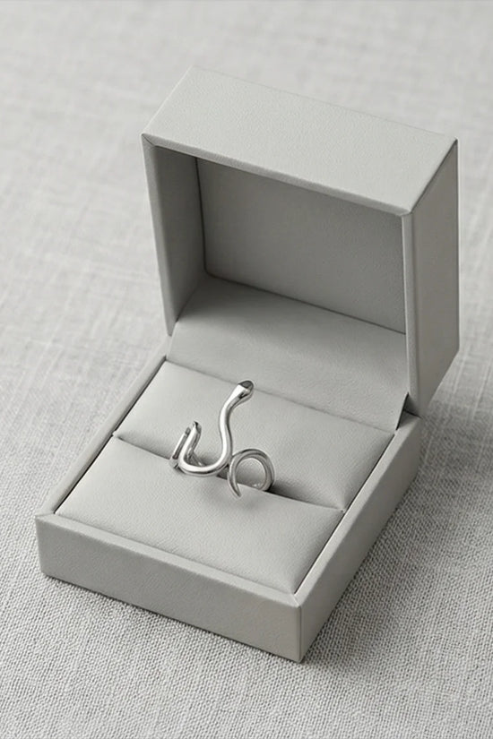 Silver Coil: Sleek Sculptural Serpentine Ring