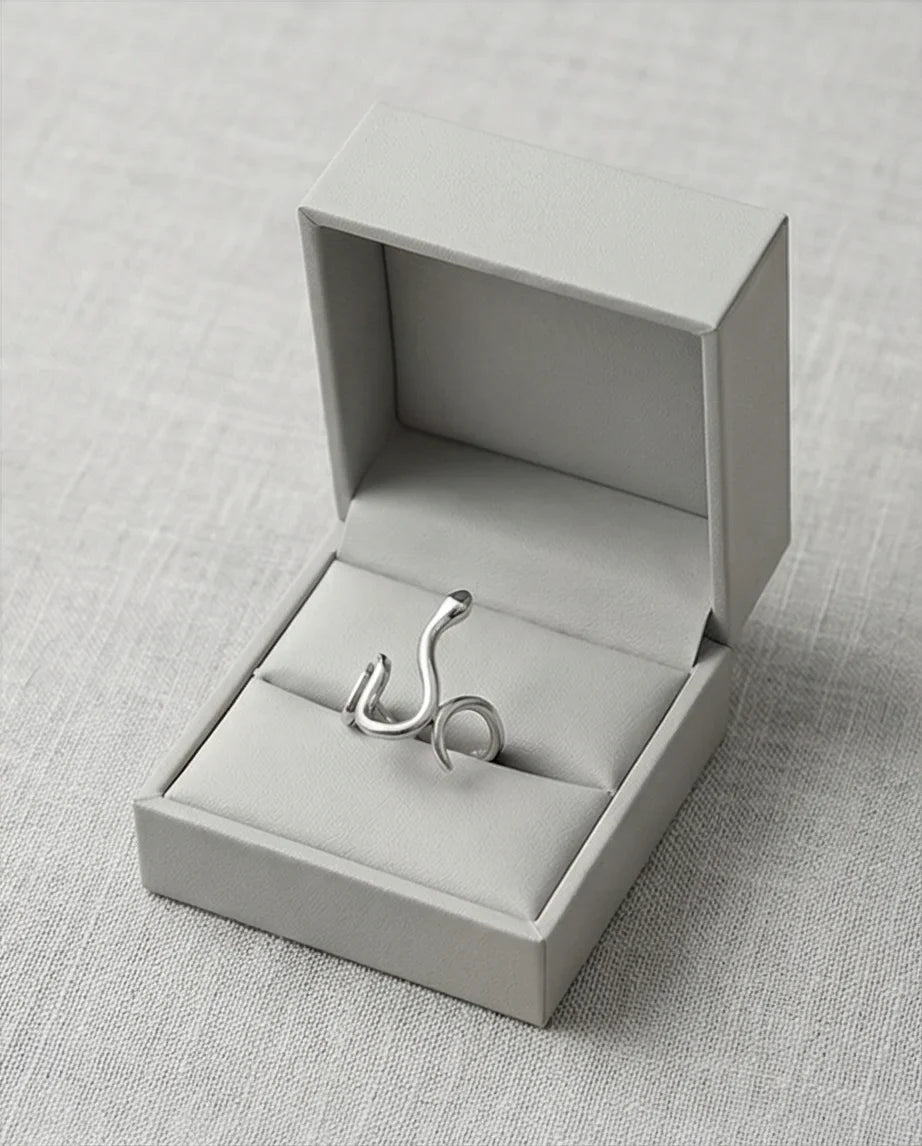 Silver Coil: Sleek Sculptural Serpentine Ring