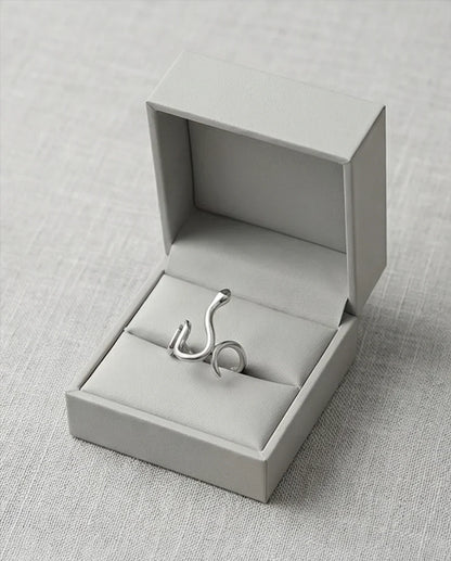 Silver Coil: Sleek Sculptural Serpentine Ring