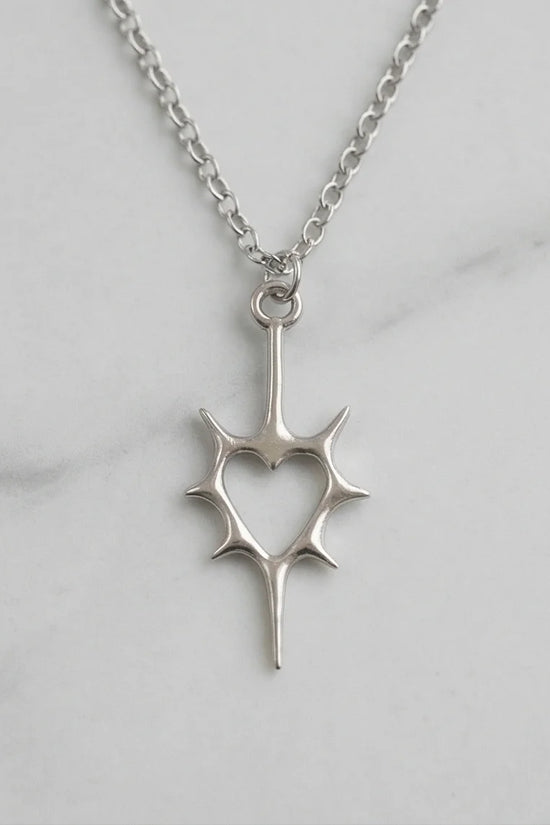 The Thorned Aura: Spiky Heart Statement Necklace