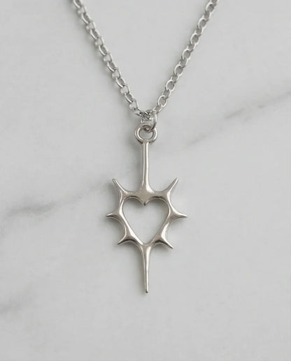 The Thorned Aura: Spiky Heart Statement Necklace
