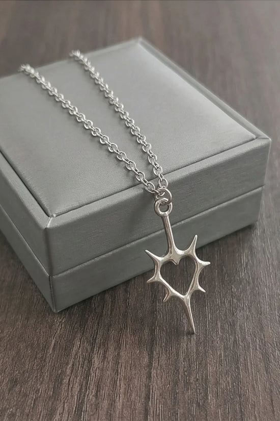 The Thorned Aura: Spiky Heart Statement Necklace