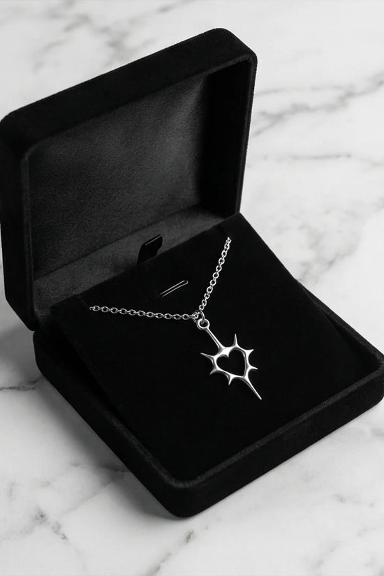The Thorned Aura: Spiky Heart Statement Necklace