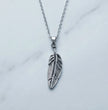 The Guardian Plume: Detailed Antique Silver Feather Necklace
