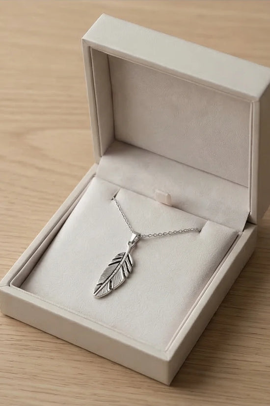 The Guardian Plume: Detailed Antique Silver Feather Necklace