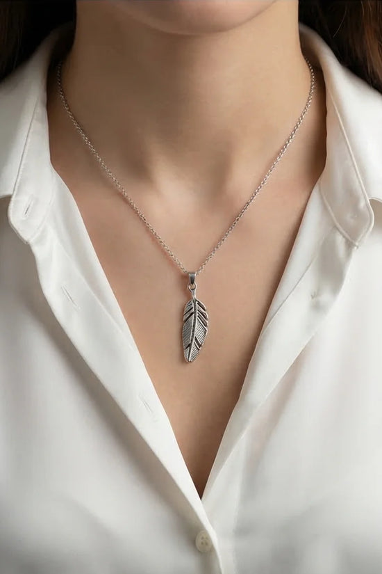 The Guardian Plume: Detailed Antique Silver Feather Necklace
