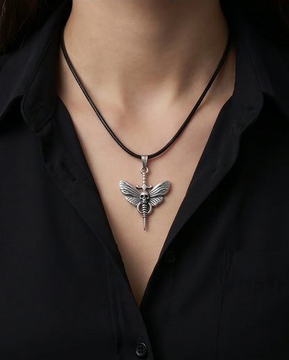 The Shadow Wing: Gothic Skull Moth Dagger Pendant Necklace