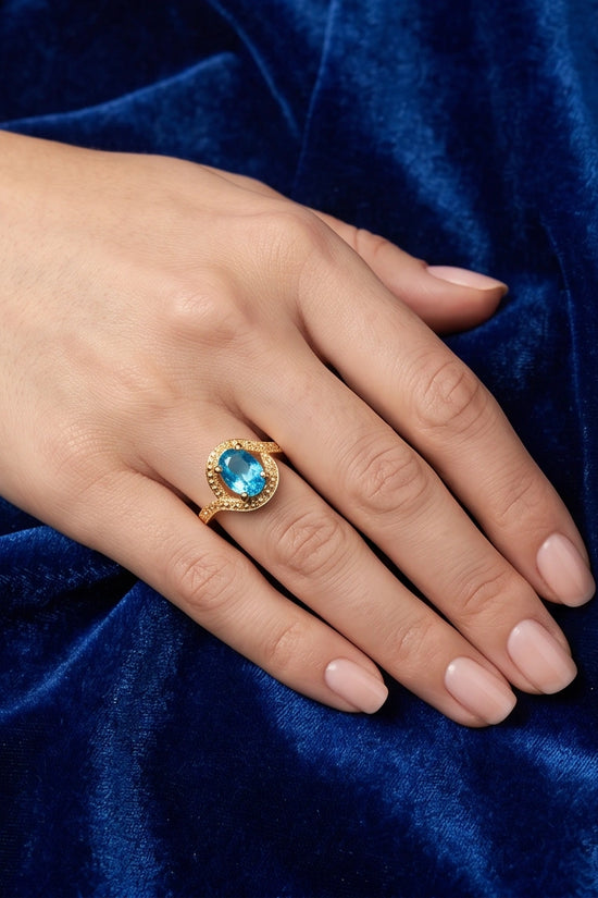 Luxury 14K Gold Oval Swiss Blue Topaz Swirl Halo Ring