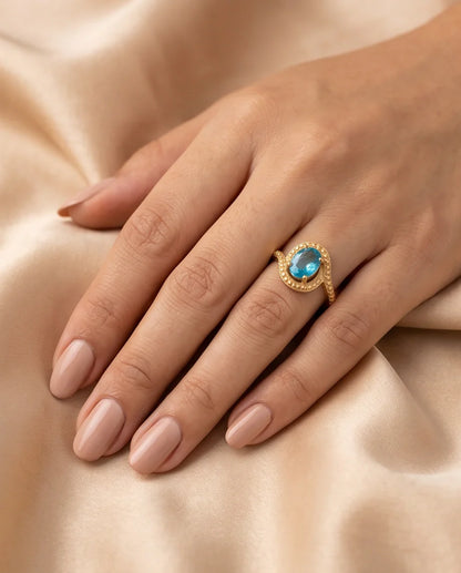 Luxury Gold Oval Swiss Blue Topaz Swirl Halo Ring