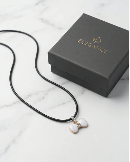 Gold and White Bow Tie Pendant Necklace