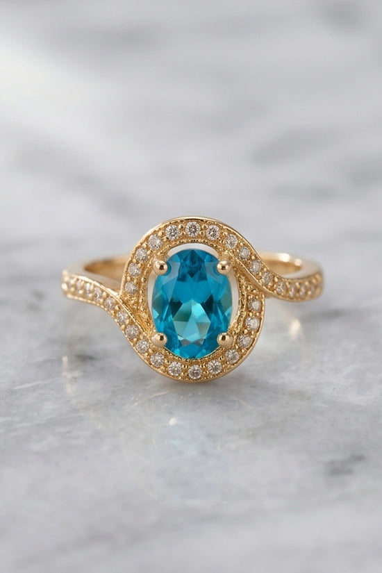 Luxury 14K Gold Oval Swiss Blue Topaz Swirl Halo Ring