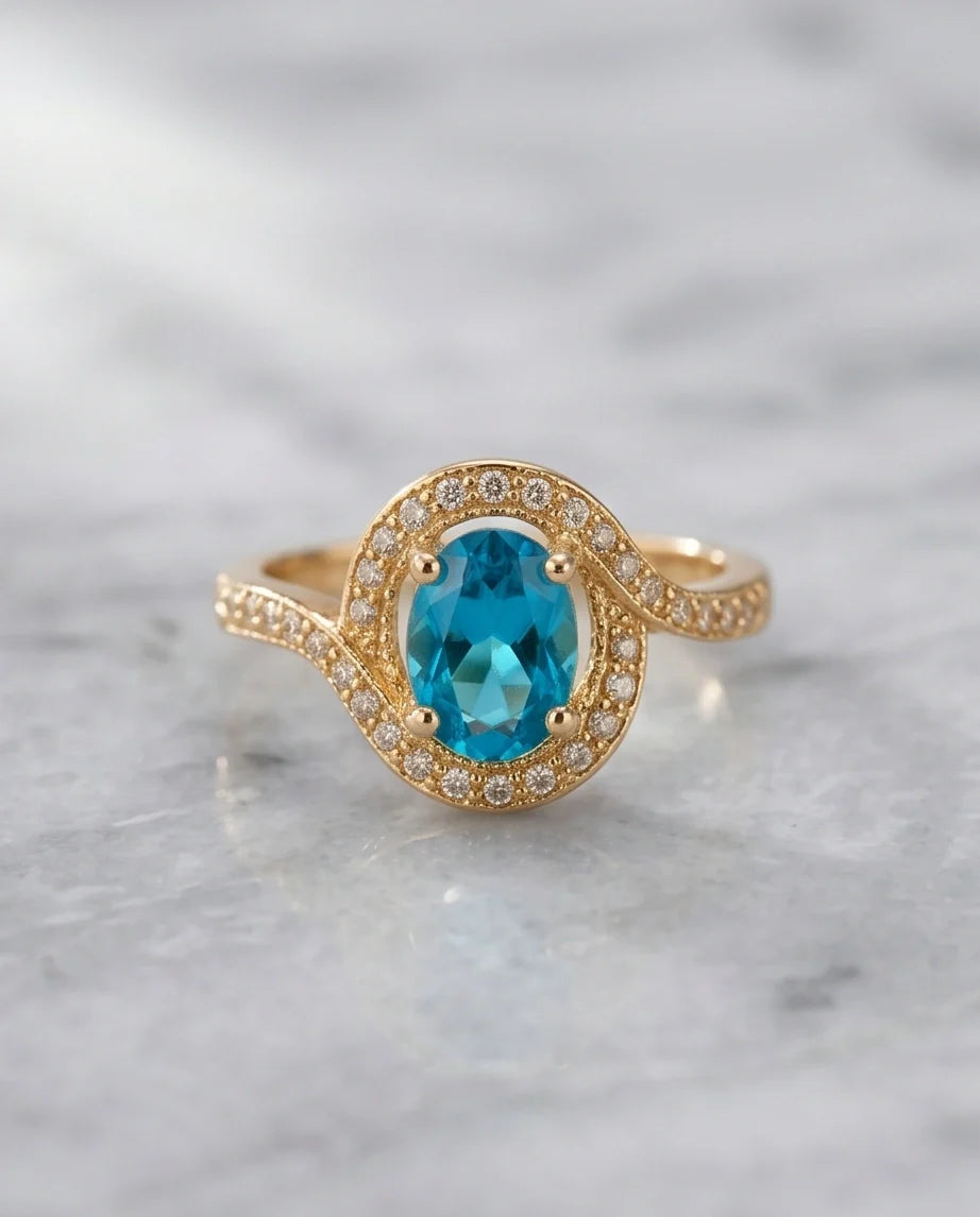 Luxury Gold Oval Swiss Blue Topaz Swirl Halo Ring
