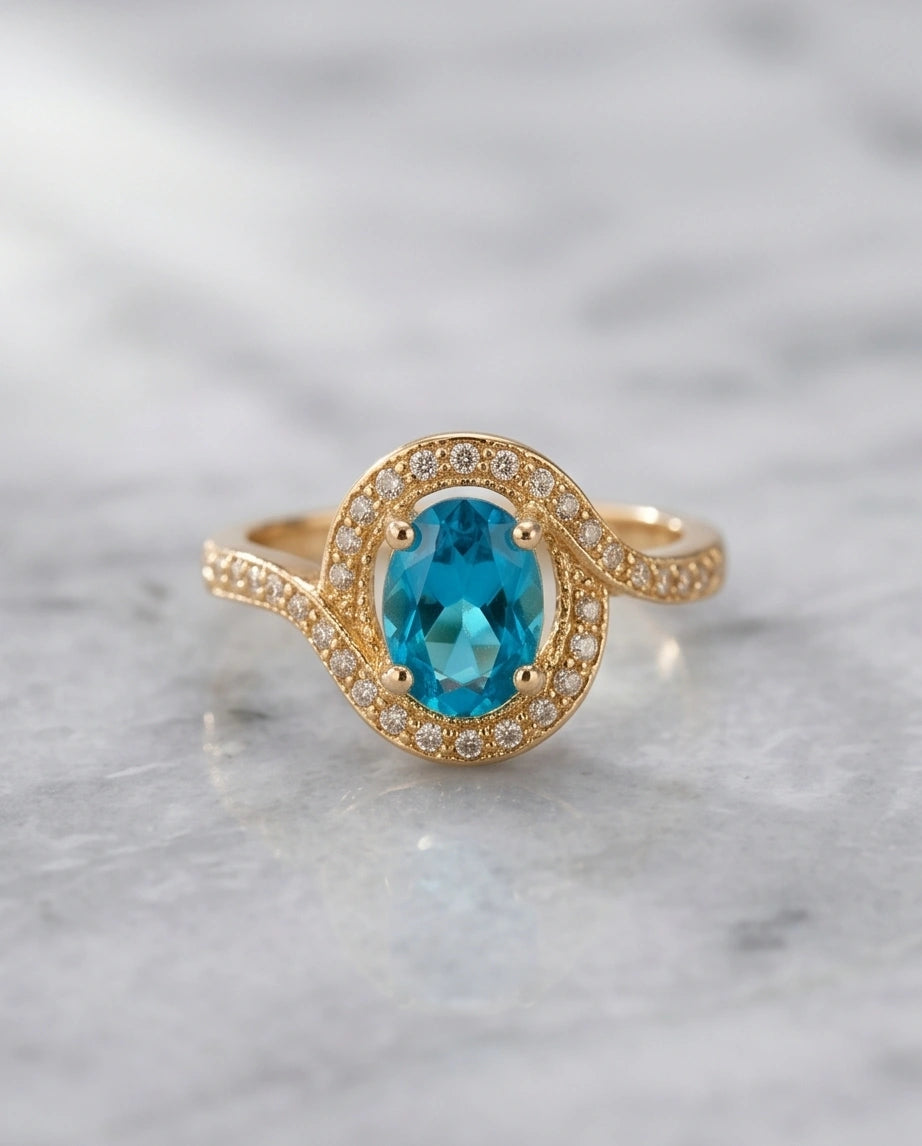 Luxury 14K Gold Oval Swiss Blue Topaz Swirl Halo Ring