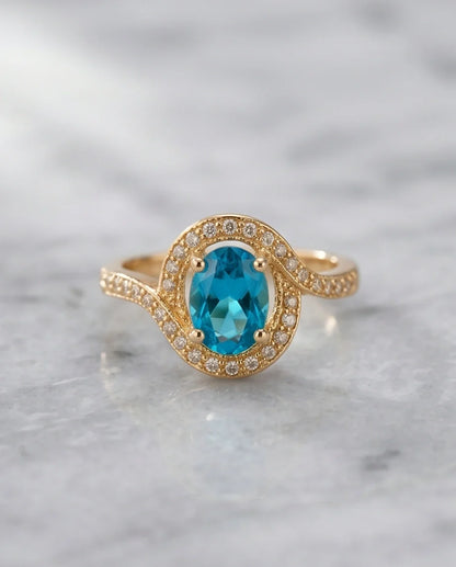 Luxury Gold Oval Swiss Blue Topaz Swirl Halo Ring