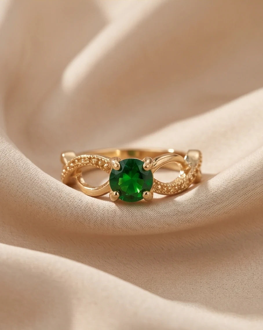 Gold Emerald Round Infinity Twist Ring