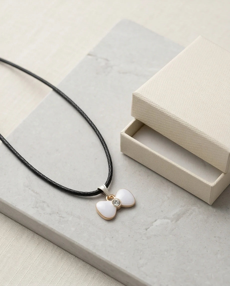 Gold and White Bow Tie Pendant Necklace