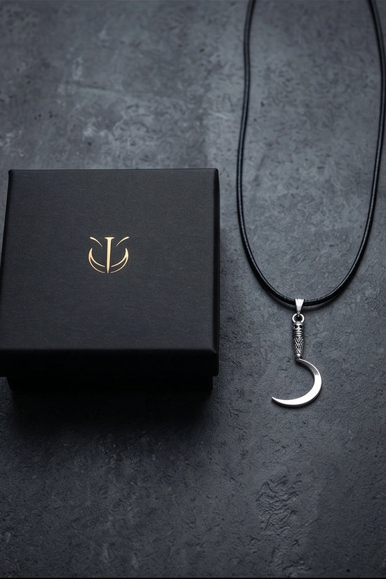 The Reaper's Crescent: Gothic Skull Sickle Pendant Necklace