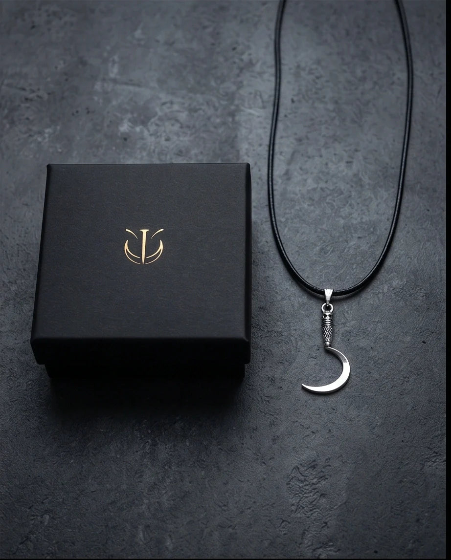 The Reaper's Crescent: Gothic Skull Sickle Pendant Necklace