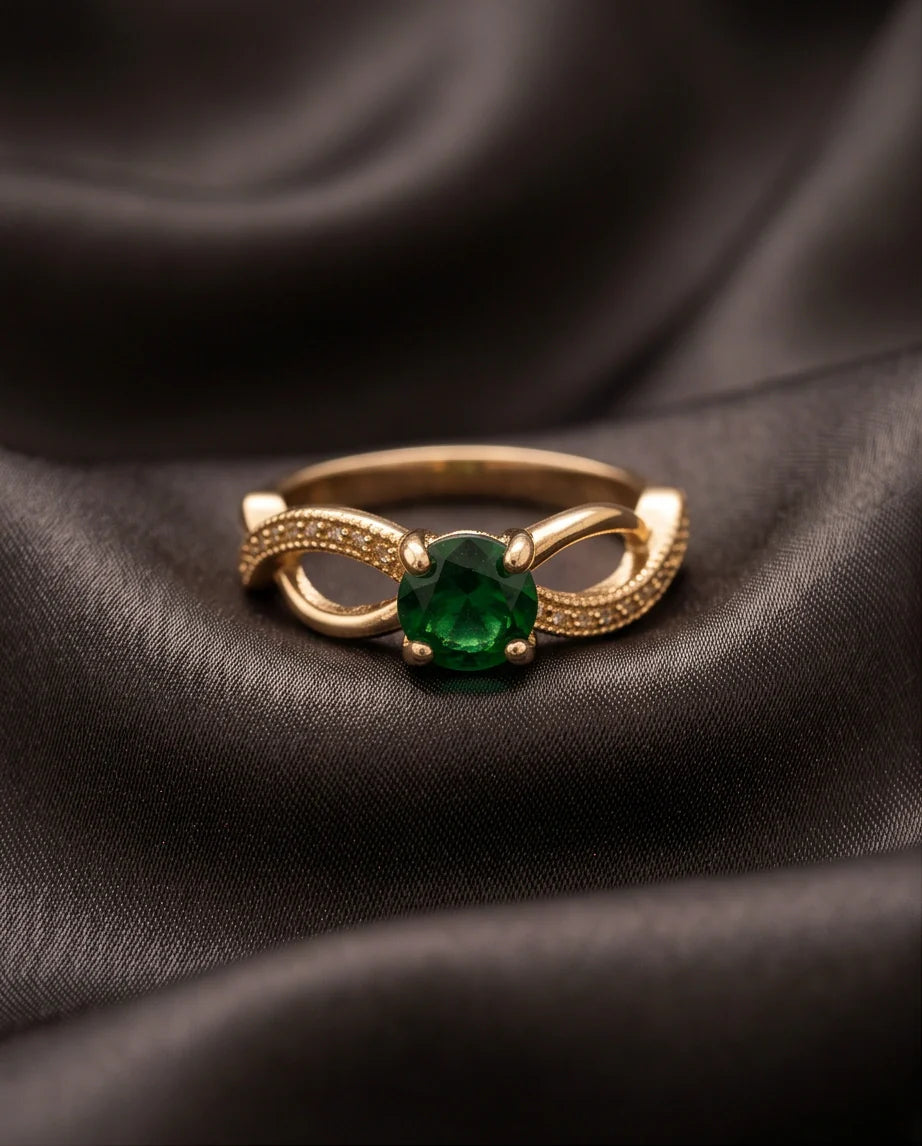 Gold Emerald Round Infinity Twist Ring
