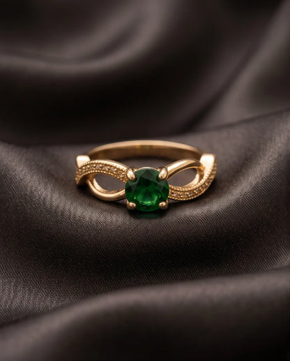 Gold Emerald Round Infinity Twist Ring