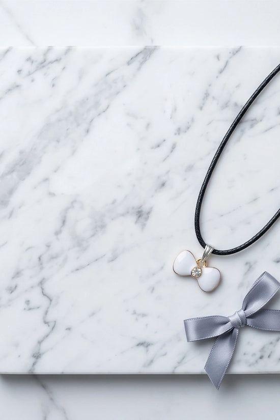 Gold and White Bow Tie Pendant Necklace