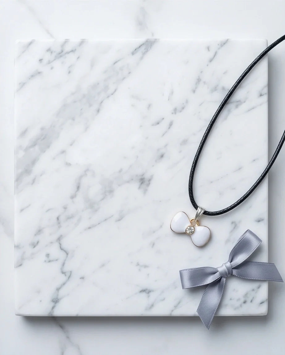 Gold and White Bow Tie Pendant Necklace