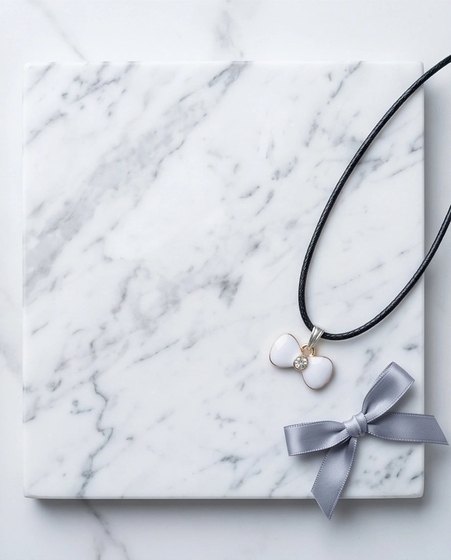 Gold and White Bow Tie Pendant Necklace