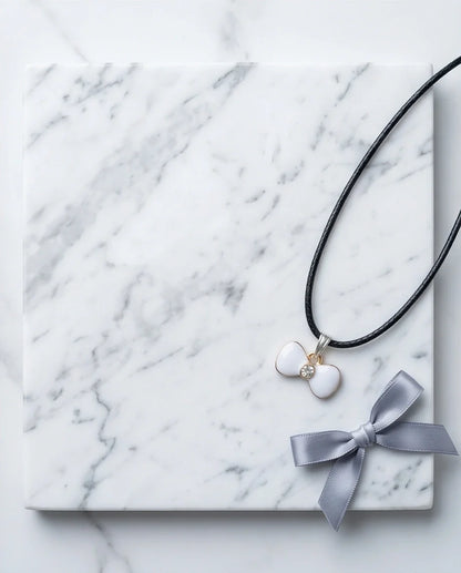 Gold and White Bow Tie Pendant Necklace