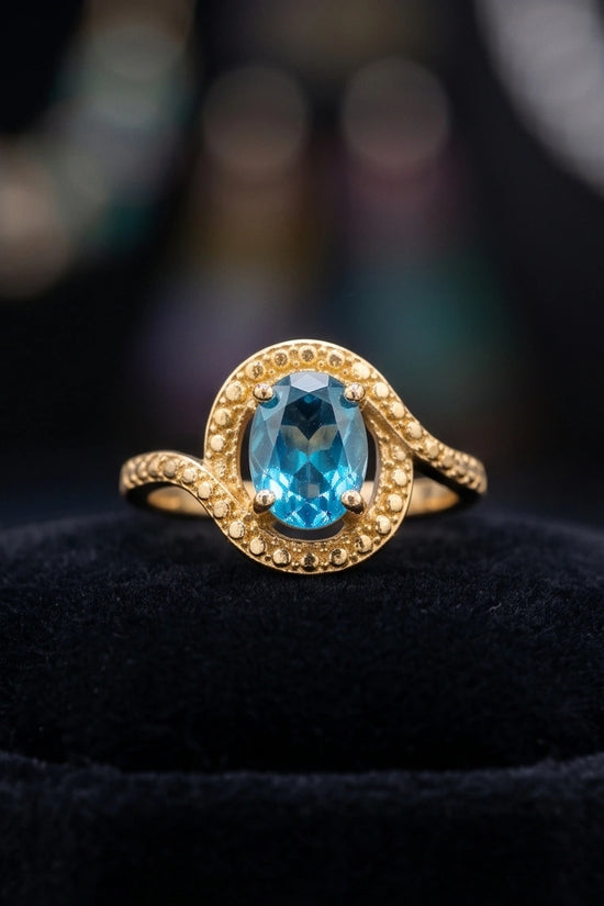 Luxury 14K Gold Oval Swiss Blue Topaz Swirl Halo Ring