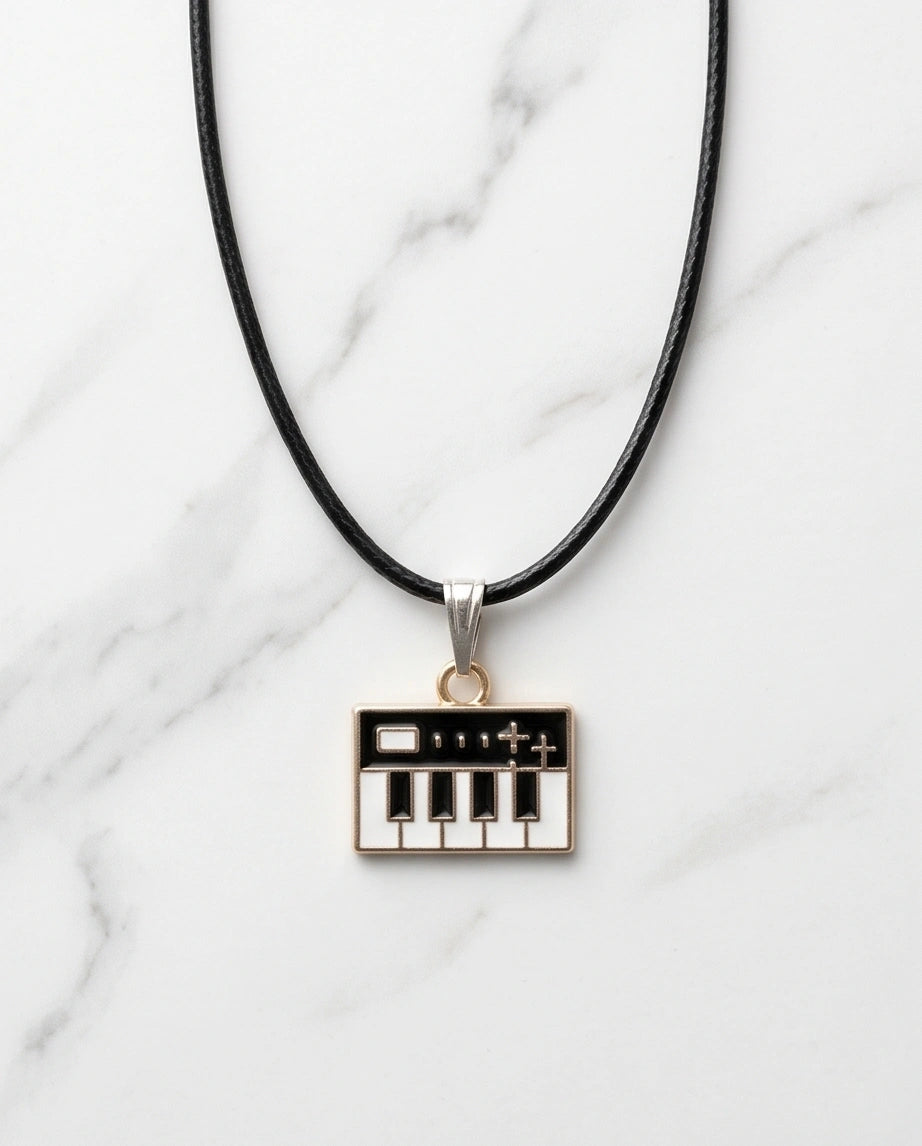 Gold and Black Synthesizer Keyboard Necklace